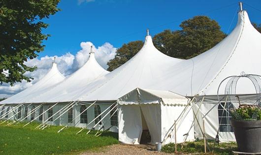 a line of sleek and modern portable toilets ready for use at an upscale corporate event in Union Park